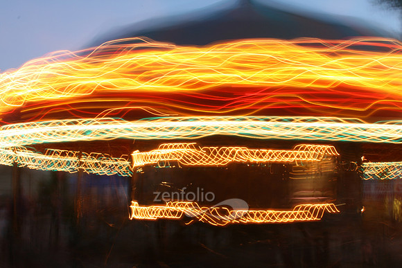 Time lapse photograph of a carousel at the carnival by Crystal Nederman