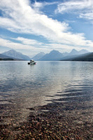 Small boat plying the waters of Lake McDonald; photograph by Crystal Nederman.
