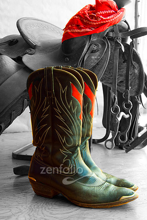 Colorized photograph of cowboy boots in a store window by Crystal Nederman