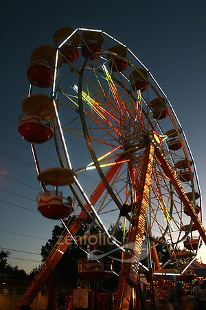 Color photograph of Ferris wheel lights at the carnival by Crystal Nederman